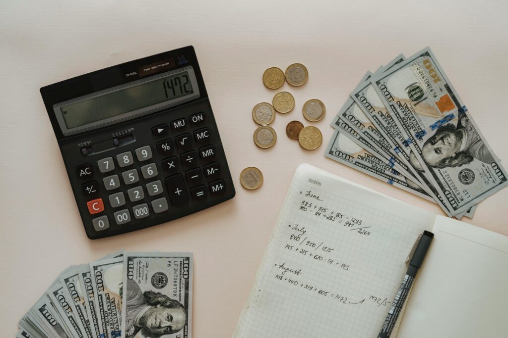 This image shows a calculator and currency dollar is lying on the table